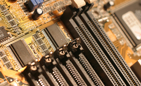 A close up of a computer motherboard and chip set.